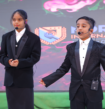 Students on stage in formal wear