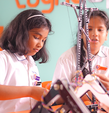 Students building with robotics kits